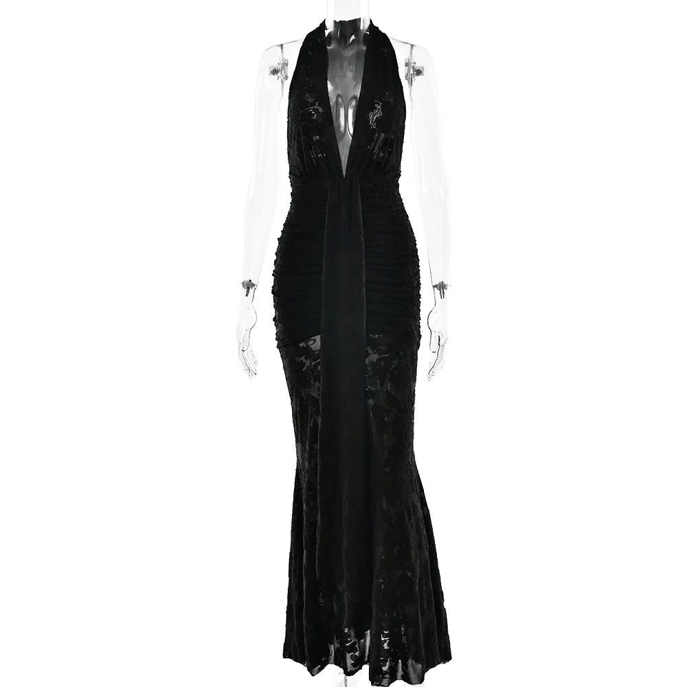 Black evening gown on a mannequin against a white background
