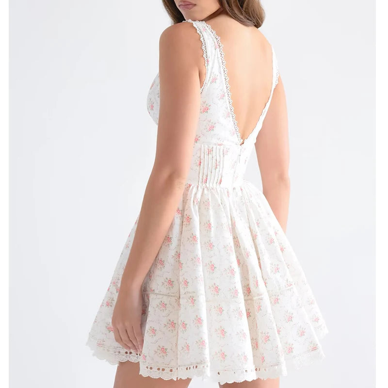 White floral dress with a backless design on a white background