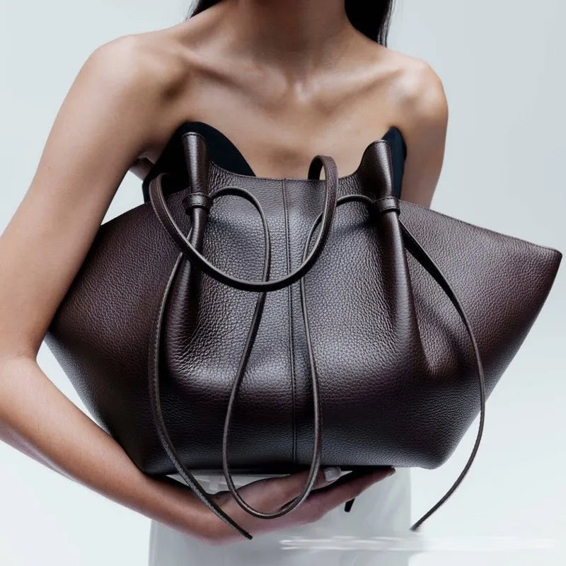 Textured PU Leather Top in brown, held by person