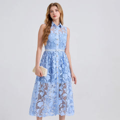Woman wearing a light blue lace dress on a white background