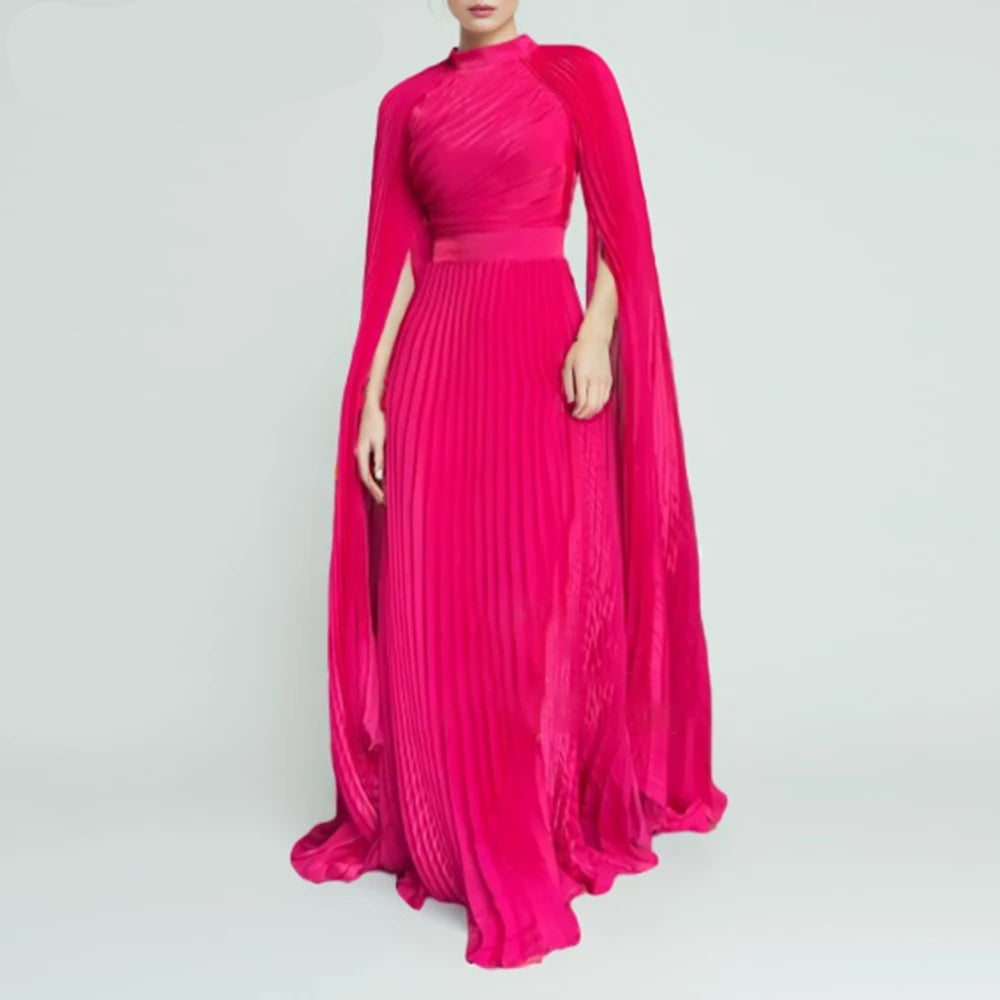 Pink evening gown with cape on a gray background, featuring the brand 'TWOTWINSTYLE'.