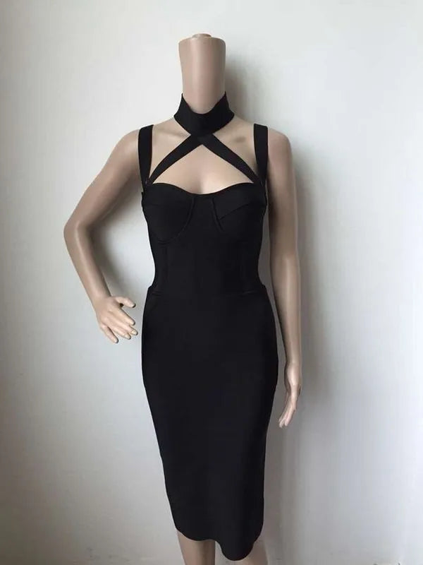 Black dress on a mannequin against a plain background