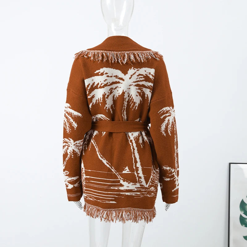 Brown cardigan with white palm tree pattern on a mannequin against a white background