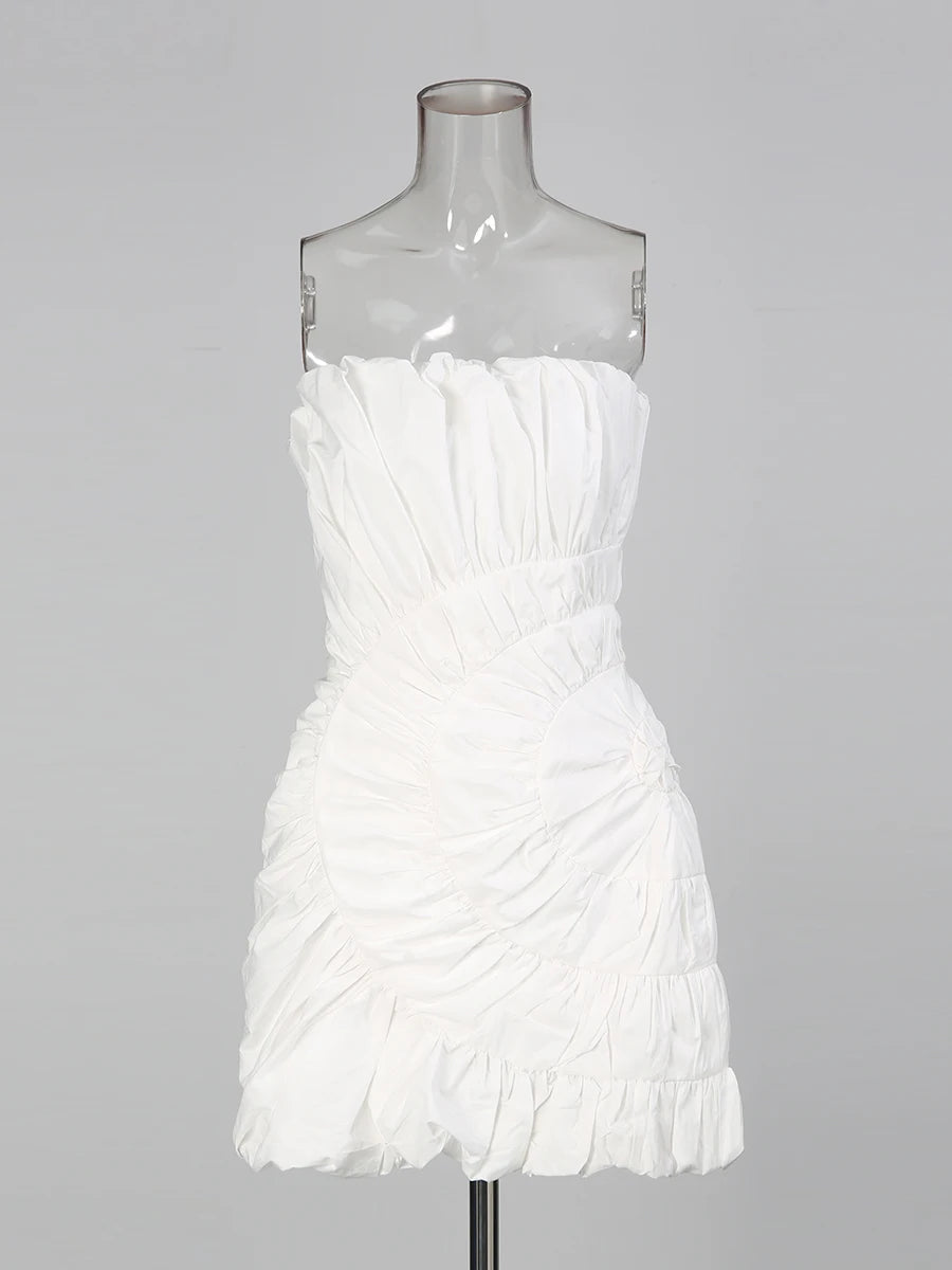 White strapless dress on a mannequin against a gray background