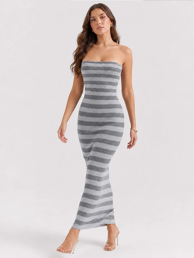 Striped strapless maxi dress walking pose