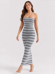 Striped strapless maxi dress walking pose