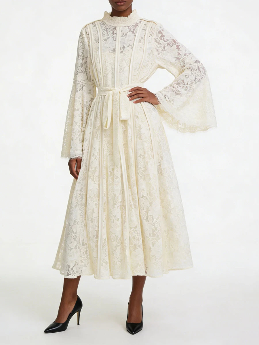White lace bell sleeve midi dress with hand on hip