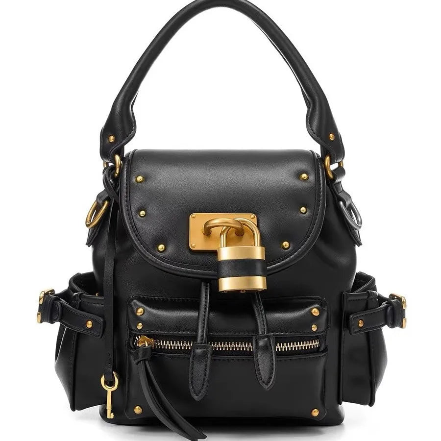 Black PU leather backpack with gold lock detail and exterior pockets.