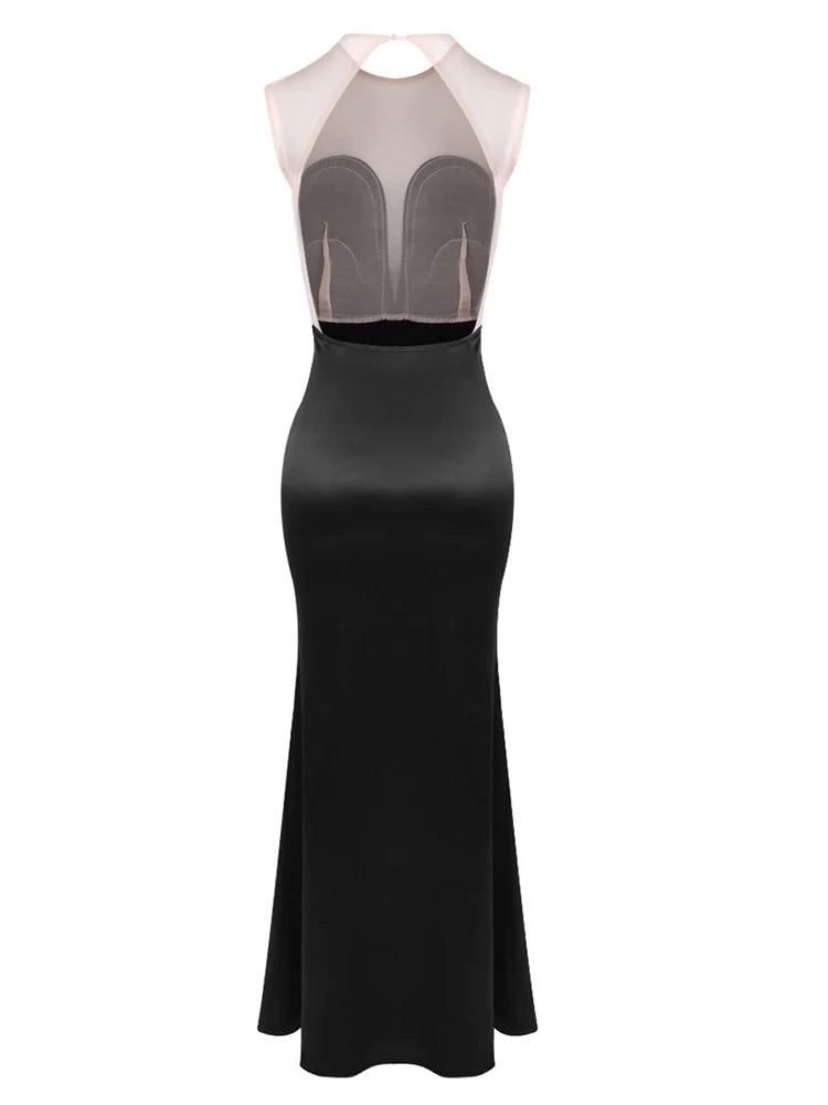 Black evening gown with sheer mesh panels on a white background