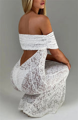 White lace off-shoulder dress on a plain background