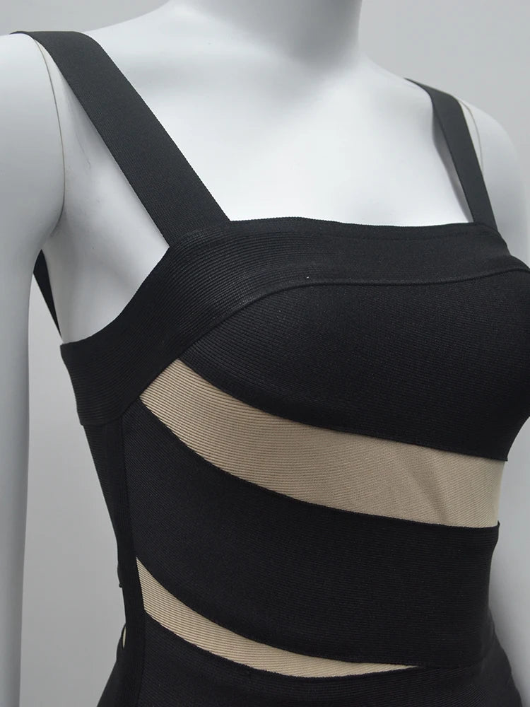 Black dress with beige accents on a mannequin against a gray background