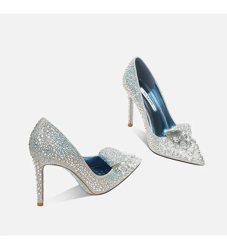 Pair of sparkling high-heeled shoes on a white background