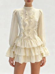 Ruffled mini dress shown with soft butterfly sleeves
