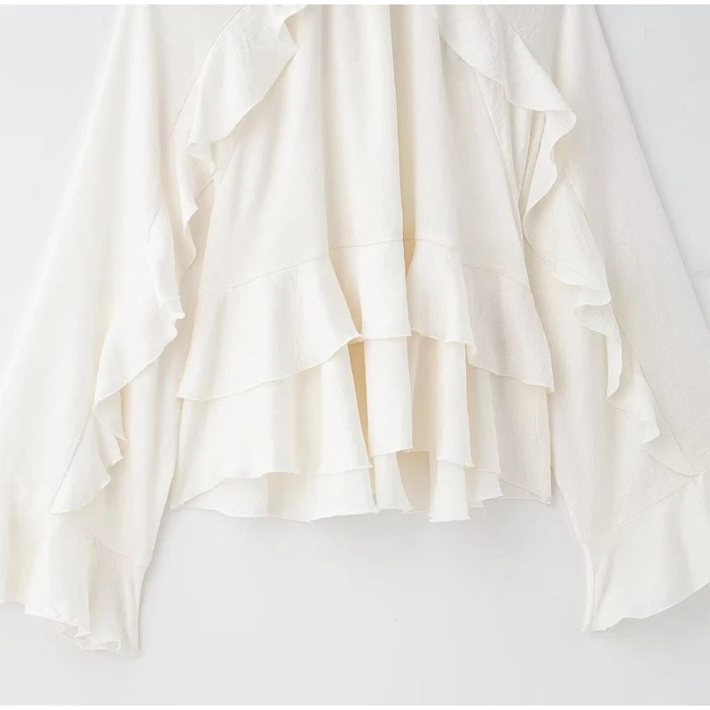 White ruffled blouse on a white background