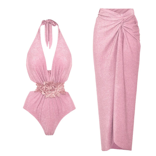 Pink halter neck cut-out swimsuit with floral applique and matching ruched wrap maxi skirt.