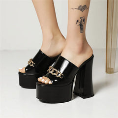 Black chunky heel platform slides with metal chain detail