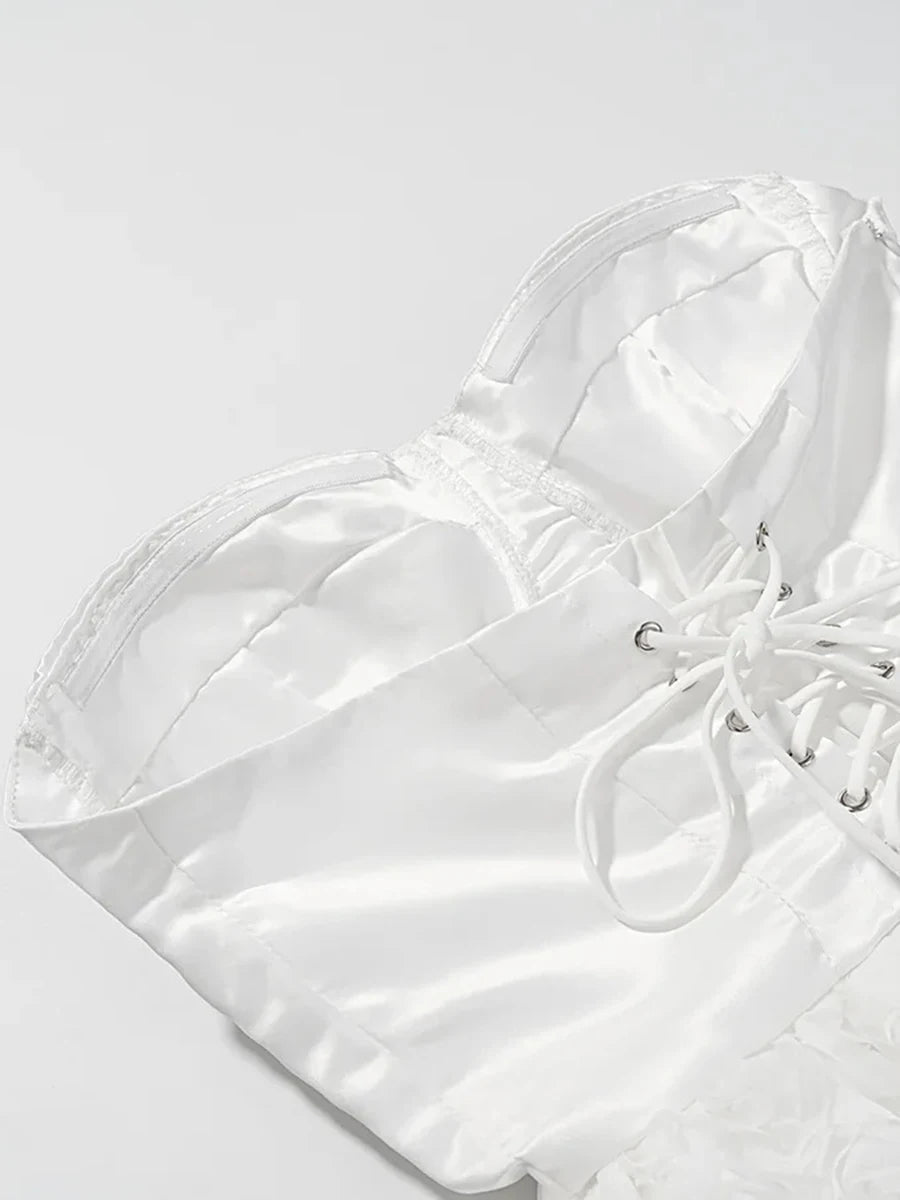 White quilted handbag with drawstring on a light gray background