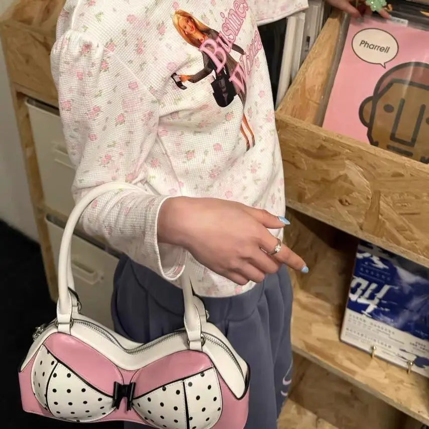 Polka dot shoulder bag being held