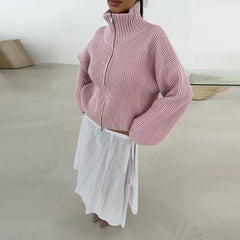 Model wearing striped knit sweater with full sleeves