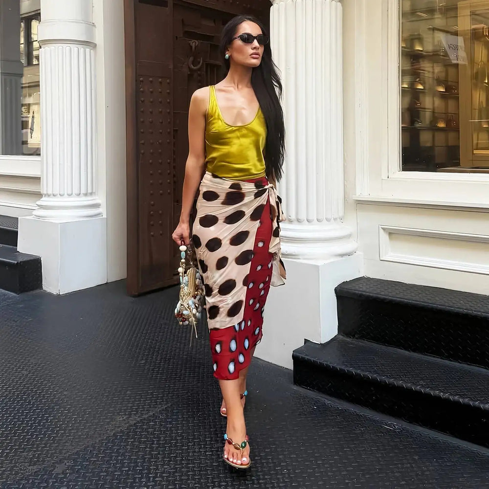 Street style of a woman in a printed wrap midi skirt