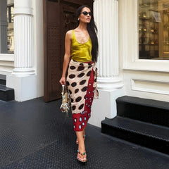 Street style of a woman in a printed wrap midi skirt