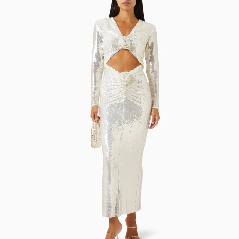 Sequin V-neck cutout midi dress styled with a handbag and heels.