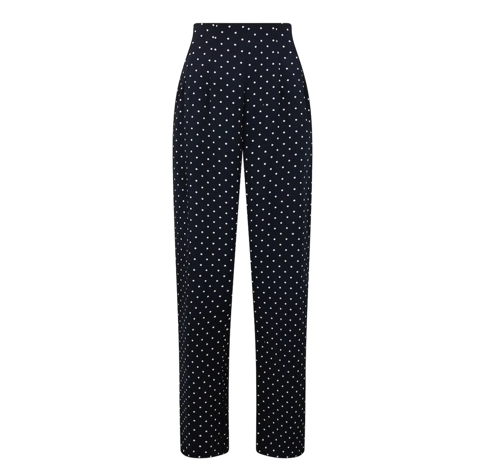 Black pants with white polka dot pattern on a white background