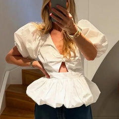 White puff sleeve top with bow detail and cutout, different angle