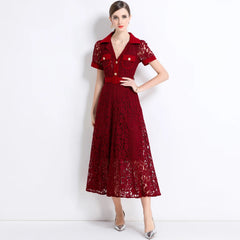 Woman wearing a red lace dress on a white background
