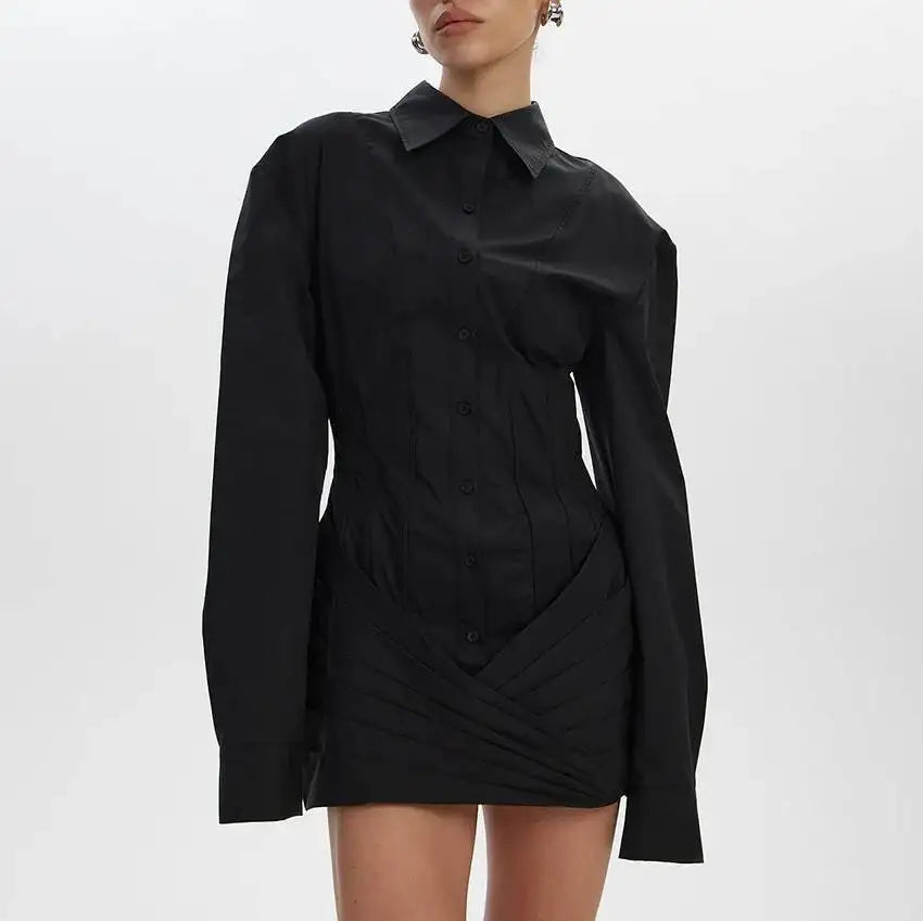 Black shirt dress worn by a model on a white background