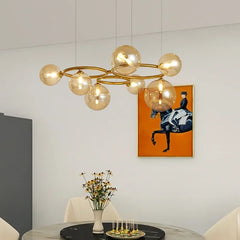 Magic Beans chandelier with smoke grey glass pendants hanging in a modern living room. Golden Atelier 4