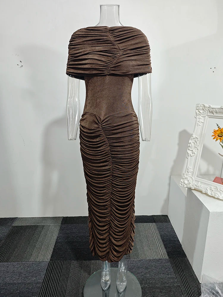 Brown ruched dress on a mannequin against a white wall.