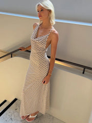 Polka dot maxi dress with backless design and spaghetti straps for evening parties