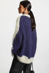 A woman wearing a comfortable blue fleece blend cardigan, perfect for fall and winter. Golden Atelier 3