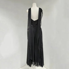 Black dress on a mannequin against a white background