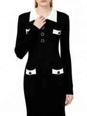 Black dress with white collar and buttons on a white background