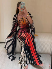 Model wearing patchwork halter neck batwing sleeve dress