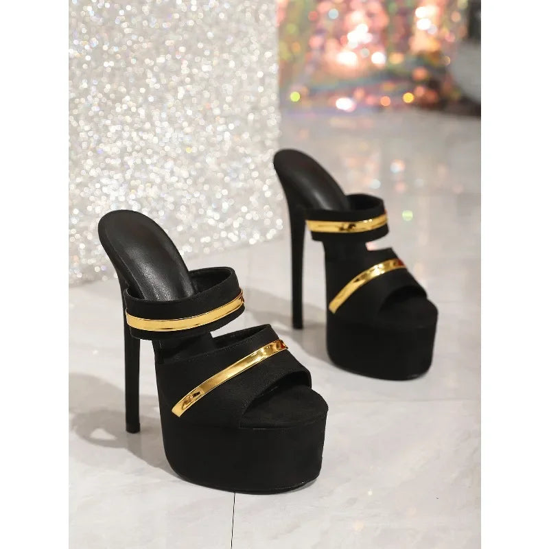 Black platform stiletto mules with gold accents displayed