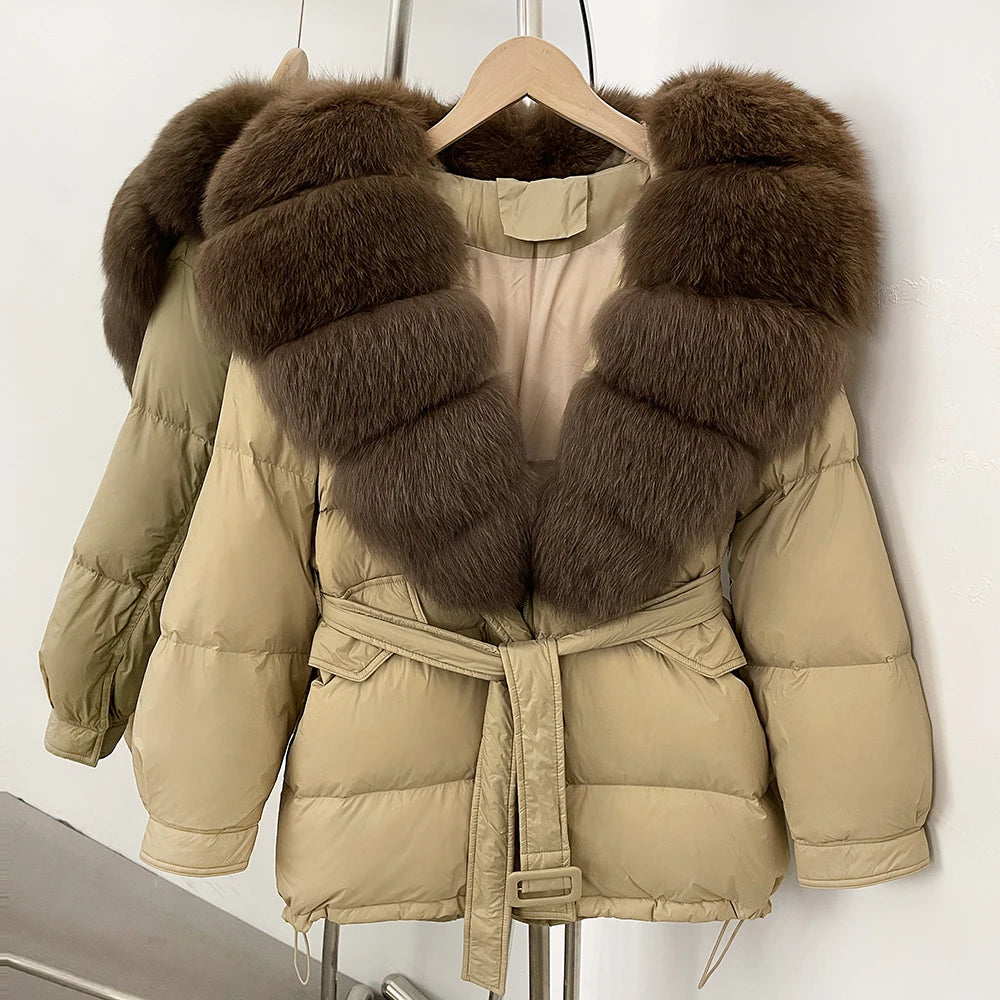 Beige puffer jacket with brown fur collar on a hanger 