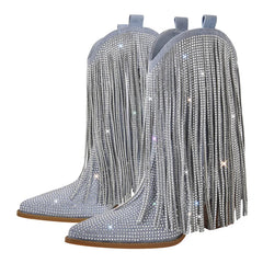 Pair of silver fringed boots with rhinestone embellishments on a white background