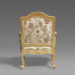 Decorative chair with floral patterned backrest on a gray background