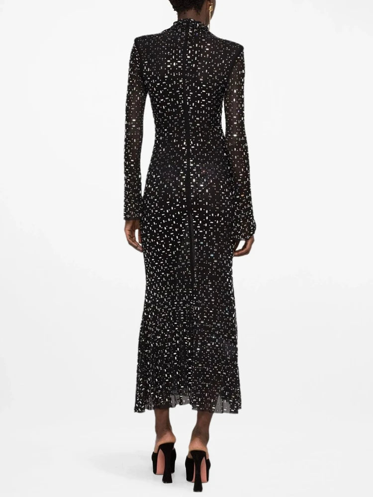 Crystal embellished turtleneck midi dress on a model, back view.