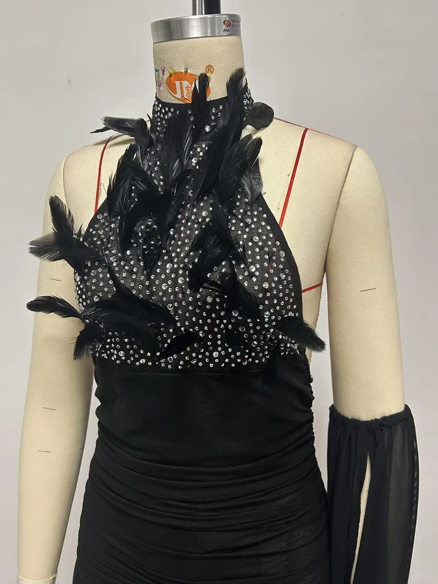 Close-up of feather and crystal embellishment on halter neck