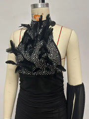 Close-up of feather and crystal embellishment on halter neck