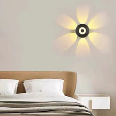  Sleek 4-sided LED wall sconce emitting warm light upwards and downwards. Golden Atelier 3