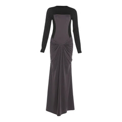 Slim sheath wrap design dress displayed in a modern purple-lit scene.
