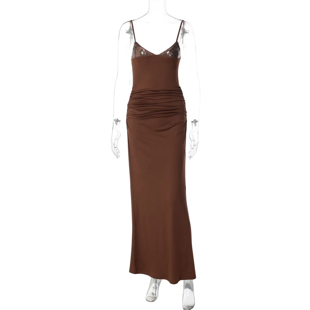 Brown evening gown on a mannequin against a white background