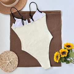 Back view of a one piece swimsuit with contrast trim