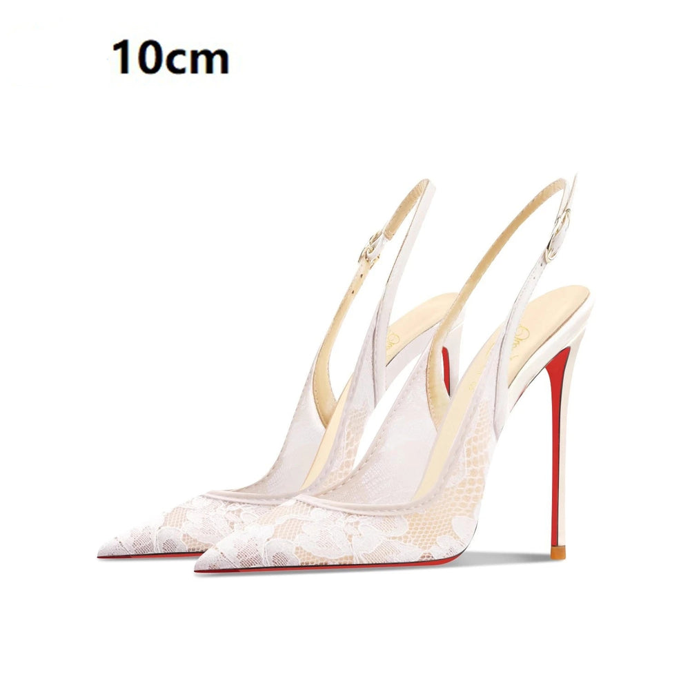 White high-heeled shoes with red soles on a white background