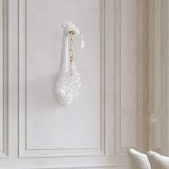 A cute giraffe-shaped wall lamp with a warm LED light, adding a playful touch to a child's bedroom Golden Atelier 2